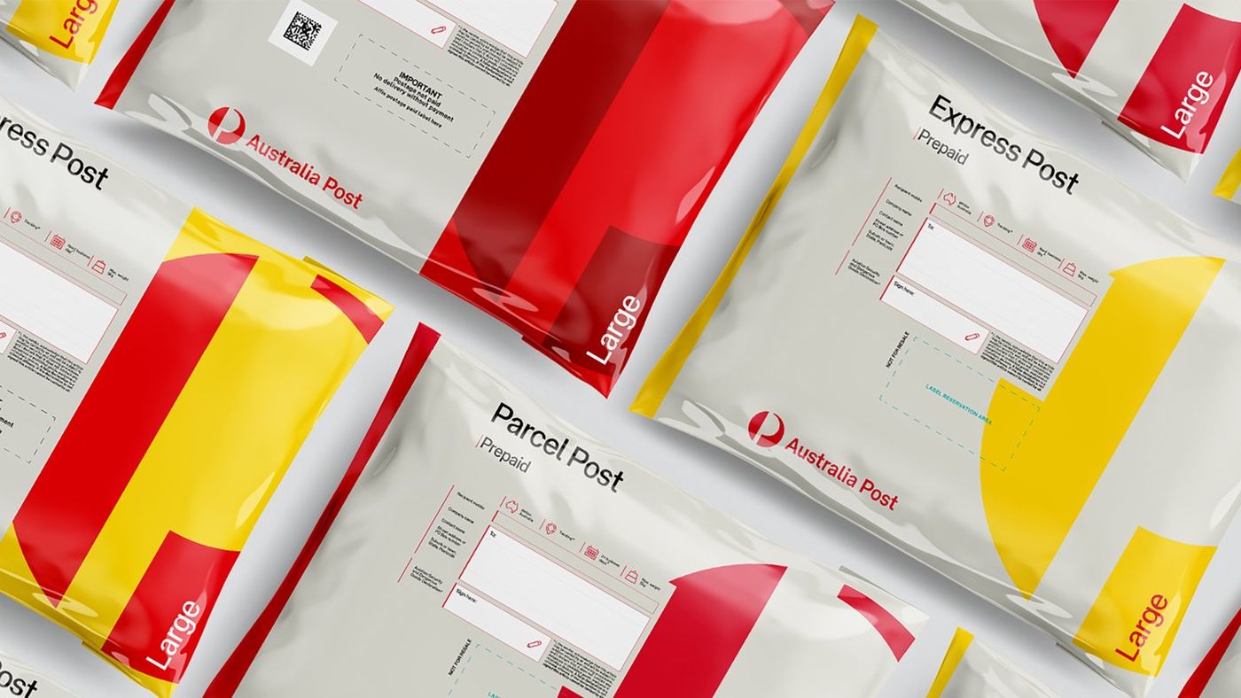Australia Post red and yellow satchels laid out in a repeating pattern