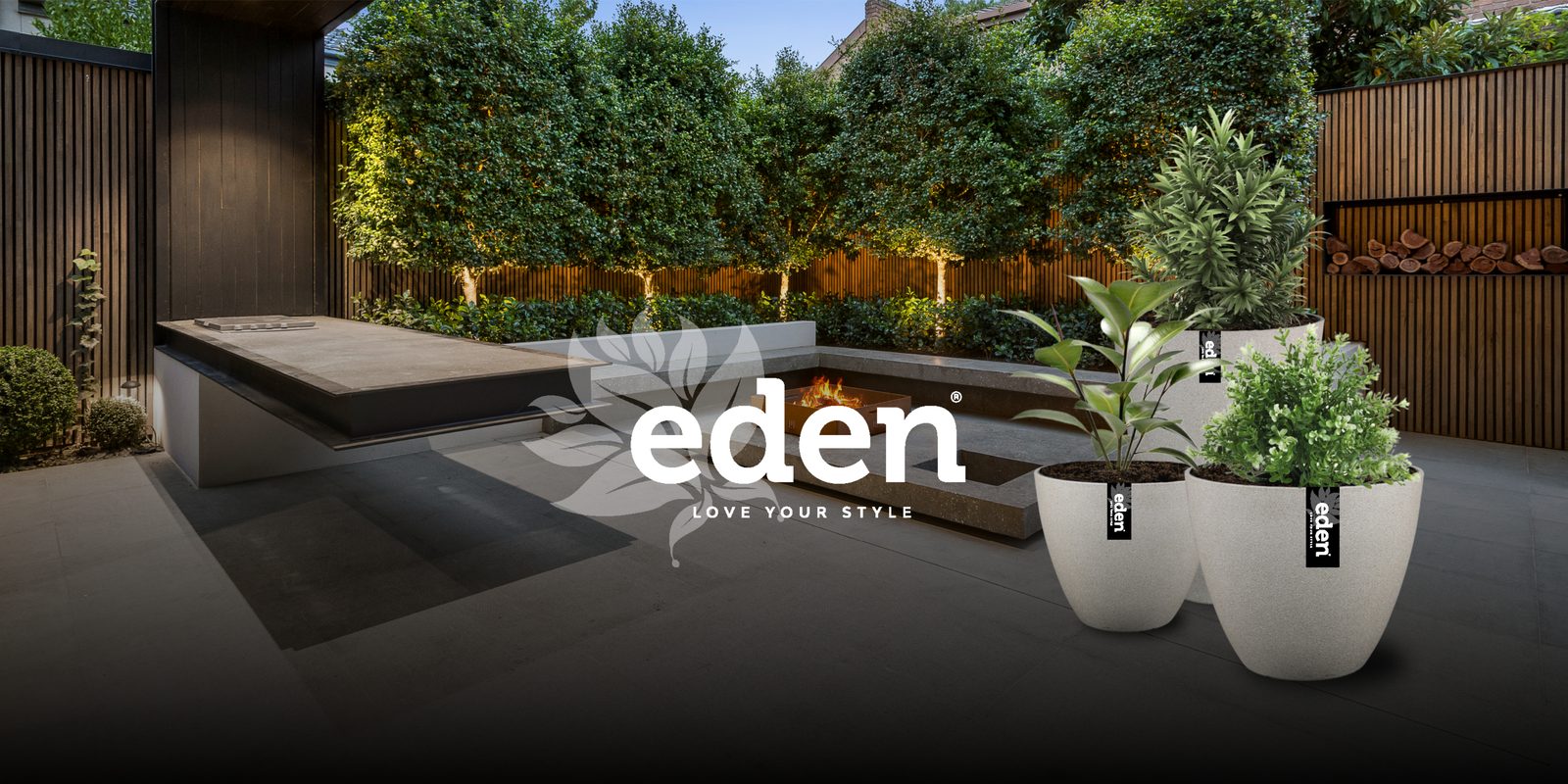 Eden planters in a dark garden setting with the Eden logo