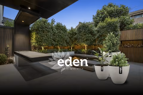 Eden planters in a dark garden setting with the Eden logo